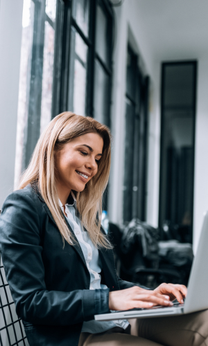 Woman on Latop for Dwellworks Destination Services