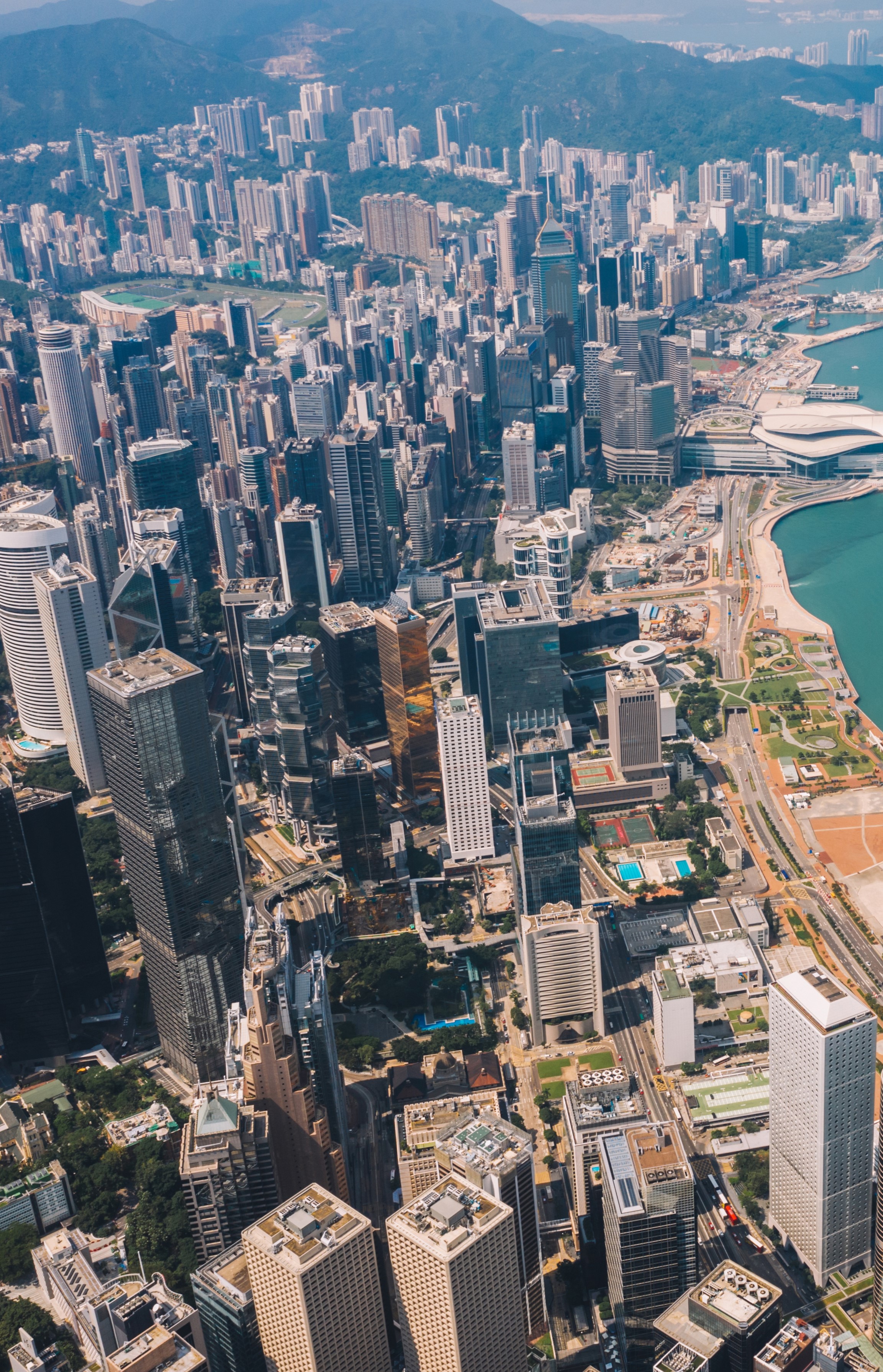 Dwellworks - Real Estate - Hong Kong skyscrapers skyline with metropolitan bay